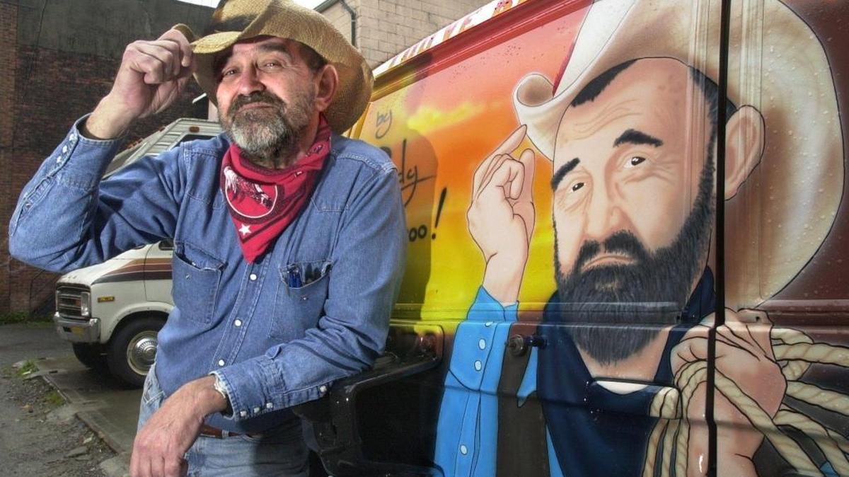 Rowdy Buckaroo, the Horseshoe Cafe's cowboy mascot, is shown in 2001 by his colorful truck. Buckaroo, whose real name was Carl Pirscher, died Oct. 10, 2015. He was famous in Bellingham for dropping dimes in expired parking meters to help shoppers avoid tickets.