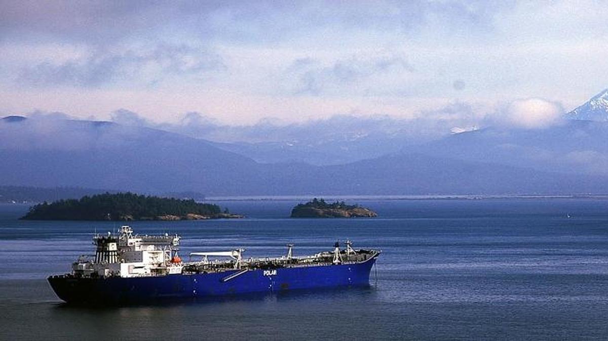 FILE - In this Nov. 19, 2005 file photo, an Endeavour-class oil tanker, which is operated by Polar Tankers, is seen anchored in Padilla Bay, near Anacortes, Wash., with a view of Mount Baker in the distance.