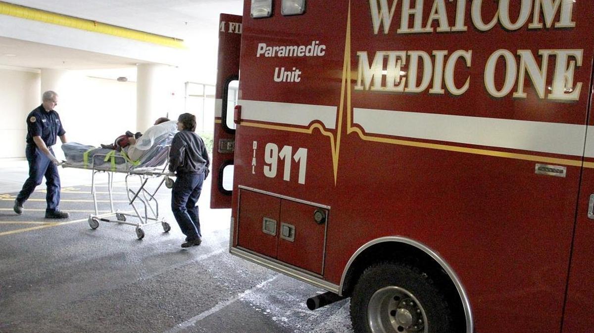 Firefighters with Whatcom Medic One wheel a patient into St. Joseph hospital in March 2012. Bellingham, looking for ways to improve its budget outlook, has asked the Whatcom County Council to put an emergency medical services levy on the November ballot.