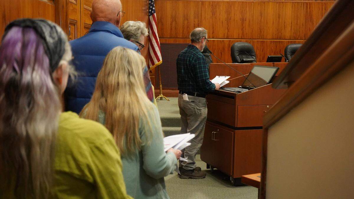 Many people lined up to give public comment during a Hearing Examiner meeting on Wednesday, March 13, 2024, to express concern about the proposed loss of more than 300 trees at the hands of a proposed infill townhome development in Bellingham, Wash.