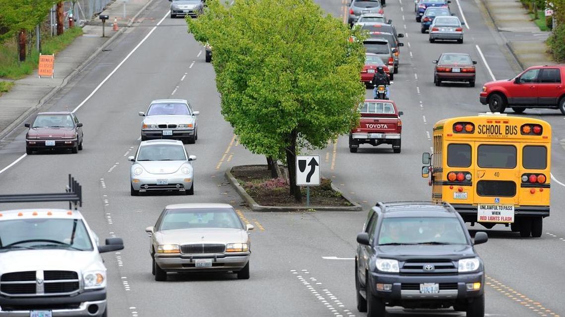 Cars travel along Bakerview Road in front of Fred Meyer on April 21, 2010.