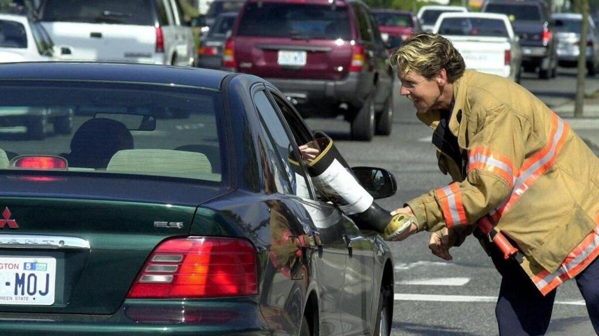 A Bellingham firefighter accepts donations to the 9/11 disaster fund during a 2001 “Fill the Boot” drive. On Thursday and Friday, June 16 and 17, off-duty firefighters will collect money from drivers at the Bakerview Road and Meridian Street intersection in a fundraiser for the Western Washington Muscular Dystrophy Association.