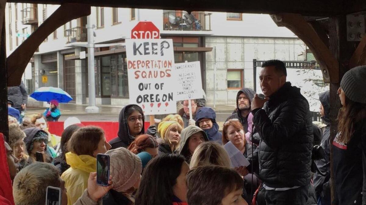 Protestors gather during a rally outside an Immigration and Customs Enforcement office in Portland, Ore. Monday, Feb. 27, 2017, after federal immigration officers reportedly stopped two vans carrying 19 workers headed to a forest in Oregon to pick an ornamental shrub and took 10 of them away.
