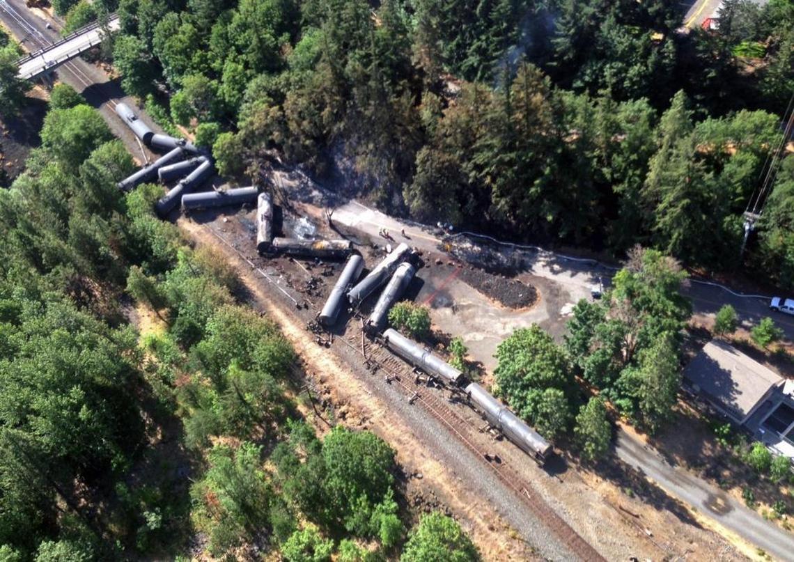 This aerial view provided by the Washington State Department of Ecology shows scattered and burned oil tank cars on June 4, 2016, after the train derailed and burned near Mosier, Ore.