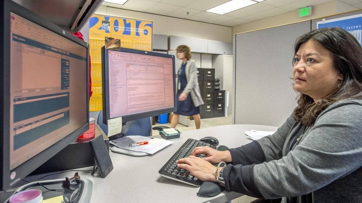 Lisa Anderson, a Public Disclosure Assistant in the Tacoma City Clerk’s office, works on a search of city records to fulfill a request in February.