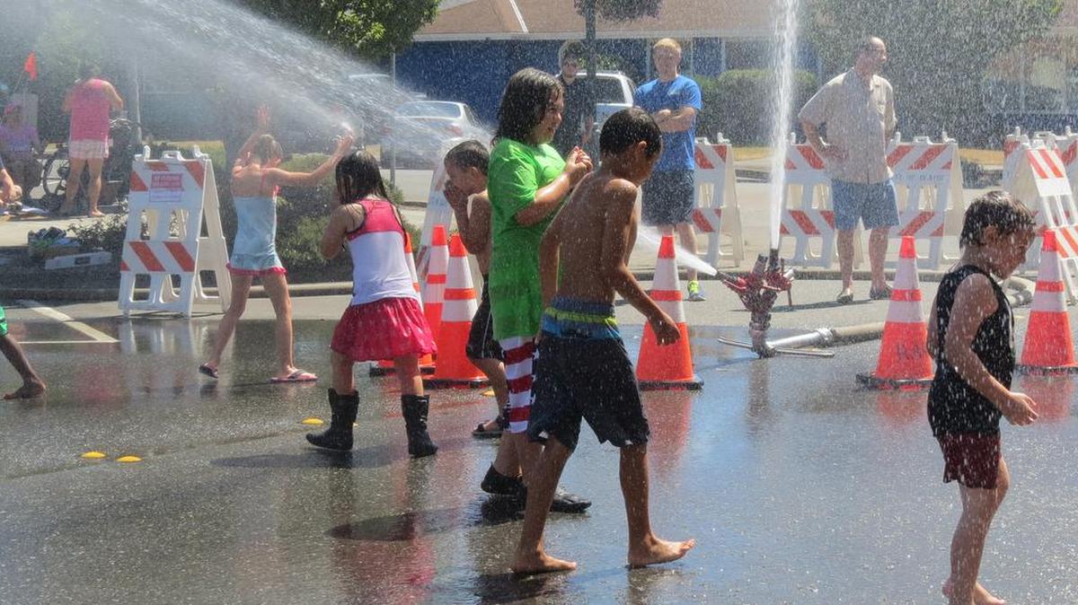 Children play in a Blaine street during Splash Days in 2015.