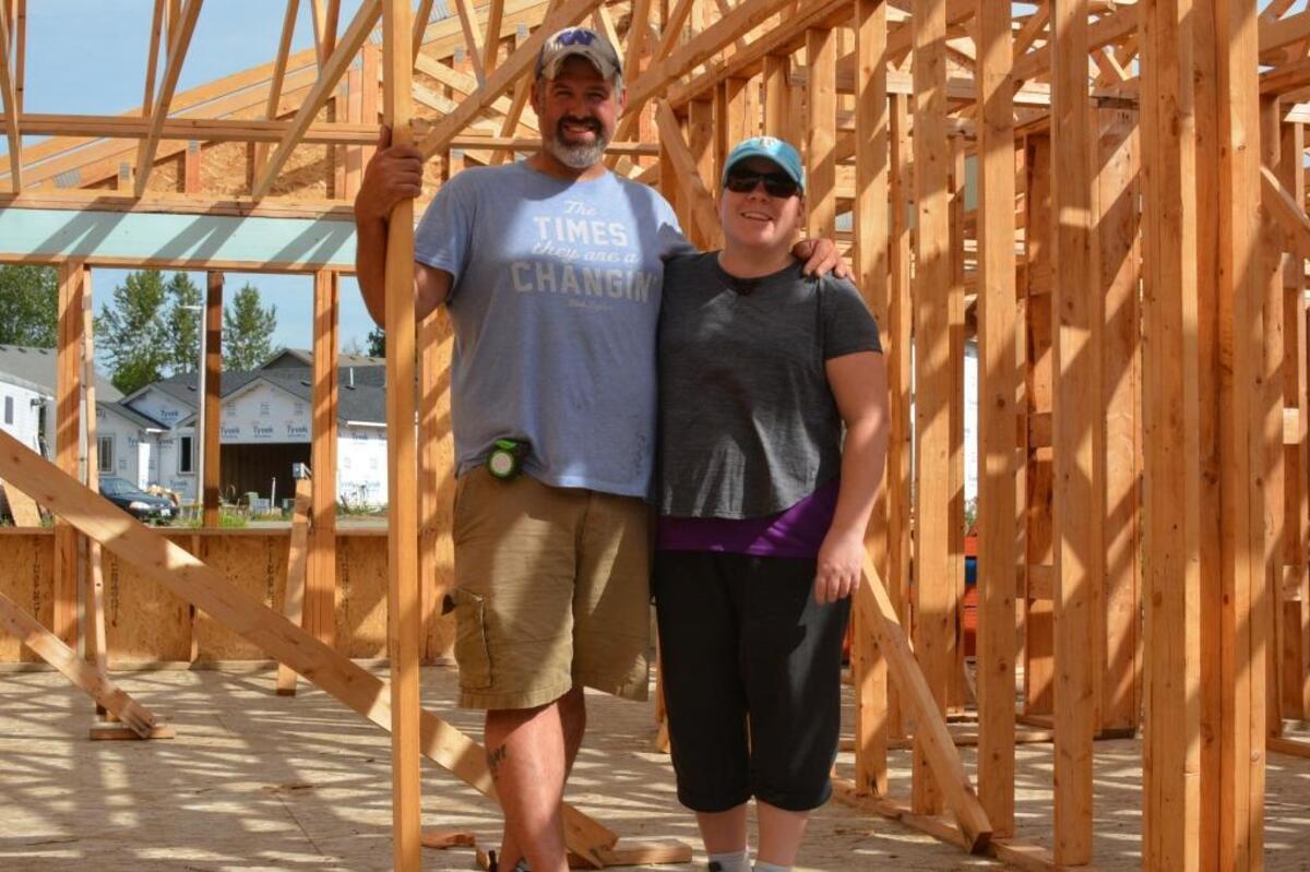 Nate and Amy Ashby stand in the living-dining area of their future home south of downtown Blaine.