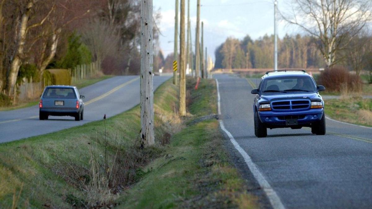 A ditch is all that separates Zero Avenue in Canada (left) and East Boundary Road north of Lynden, Washington. It’s closely monitored by the U.S. Border Patrol, but asylum seekers say it’s an easy walk to Canada.