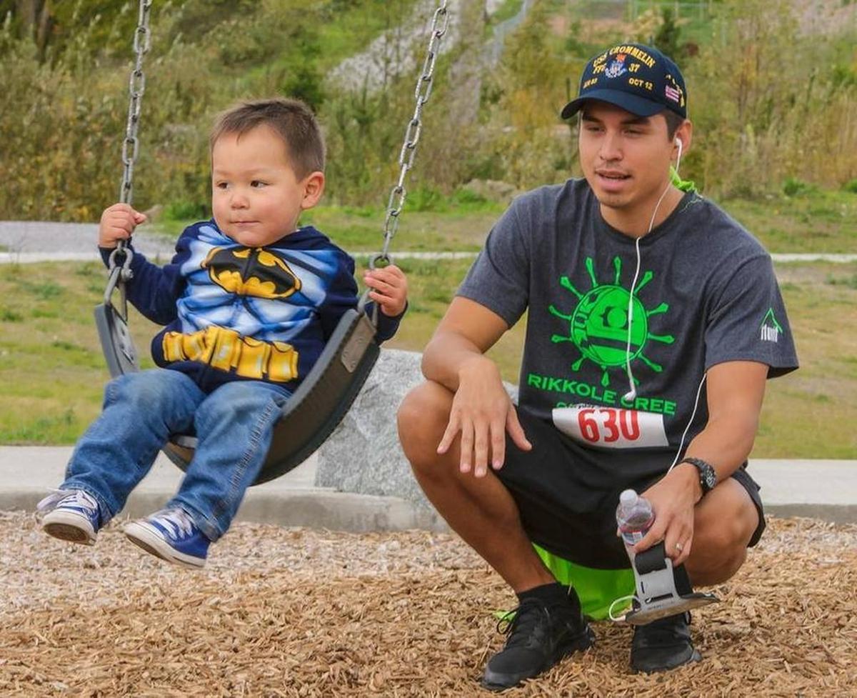 Colin Lawrence of Bellingham pushes his sone Keanu, 2, on the swings after the 3rd annual Everyday Superheroes 5K Run & Walk on Sunday morning Oct. 10, 2015, at Squalicum Creek Park in Bellingham, Wash.