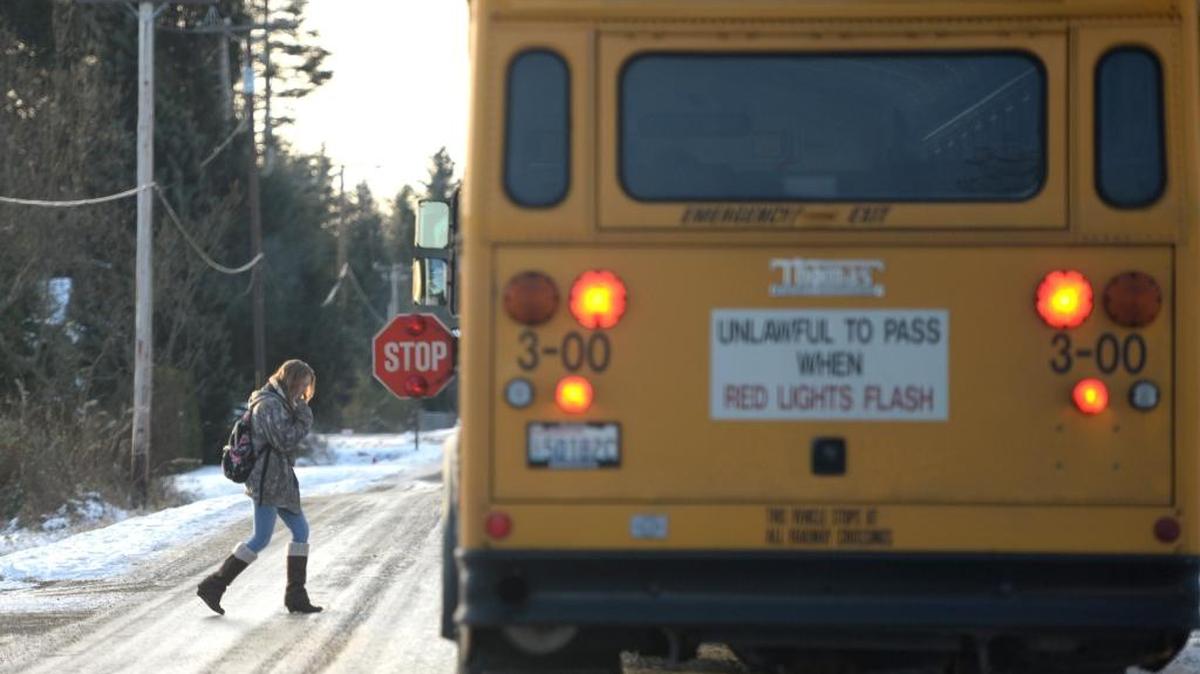A Blaine student board a bus on Harborview Road in Birch Bay Wednesday, Dec. 14, 2016. Blaine schools started two hours later due to the weather.