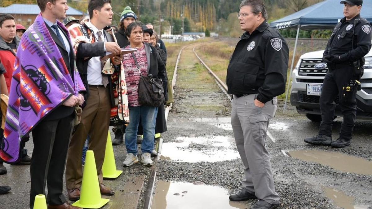 Attorneys Ryan Dreveskracht, left and Gabriel Galanda confront Nooksack Tribal Police Chief Rory Gilliand at a roadblock to the tribal court house in Deming, Wednesday, Nov. 9, 2016.