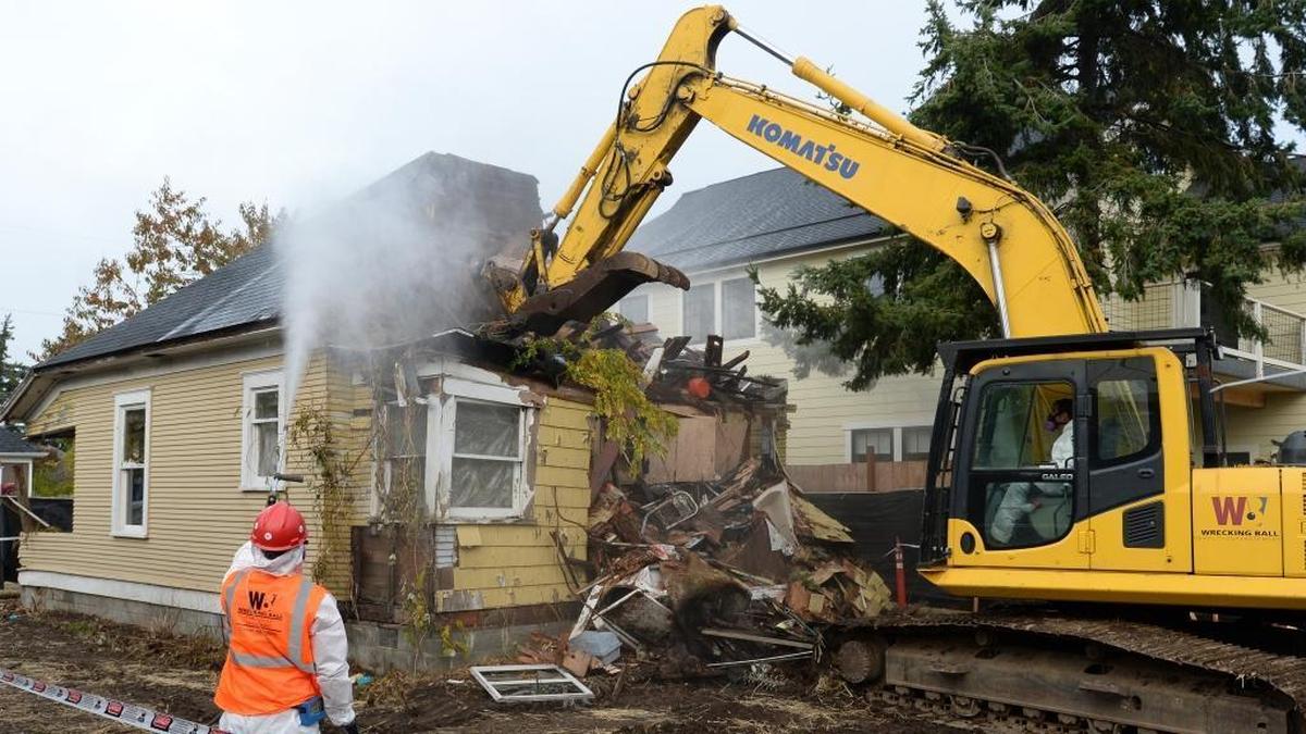 Workers from Wrecking Ball Demolition take down 2512 Lynn St. in Bellingham, Monday, Oct. 23, 2017.
