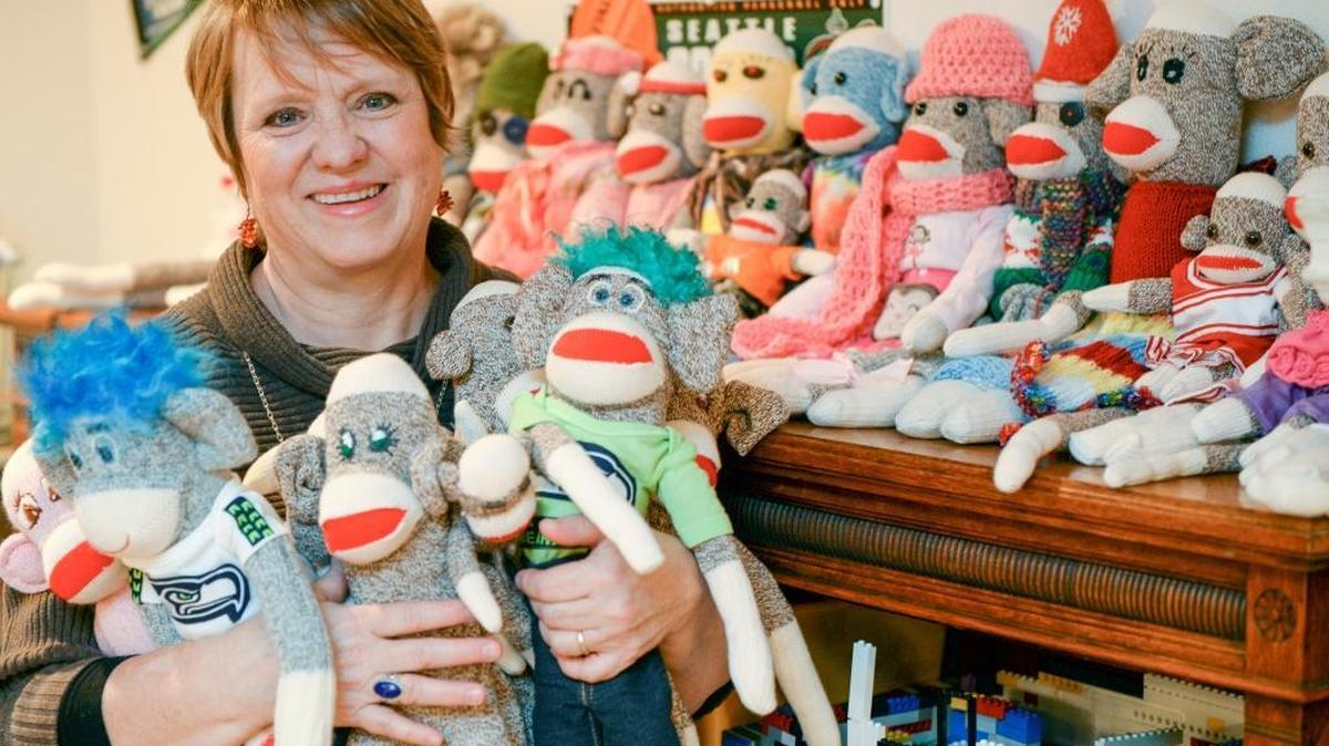 June Fraser Thistle of Bellingham works with other volunteers and with fellow employees of Western Washington University to make sock monkeys for foster children. Some of the monkeys have “hair” made from wool donated by Denise Mor, who raises sheep and works at Western.