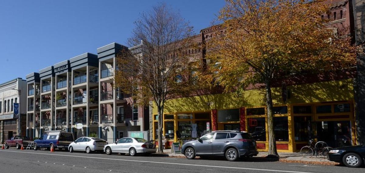 Built in 1903, the Maple Block building on North State Street now houses State Street Thrift & Vintage, and Pepper Sisters Restaurant. Early tenants of the building included a paint and wallpaper company, a funeral parlor, and one of Bellingham’s first car dealers.