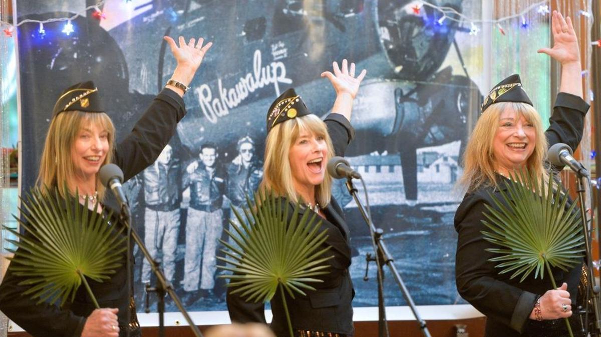 The Pakawalups — sisters Cathie Ledray-Senff, left, Sue Ledray Murray and Vicki Ledray Grabricki — perform at The Willows retirement home in Bellingham Friday, Nov.13, 2015. The sisters named their group after the B-17 bomber their father Vincent Ledray flew in WWII.
