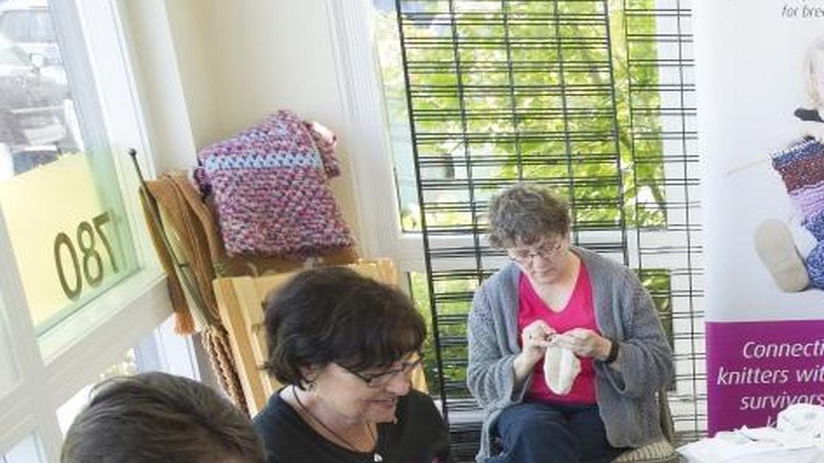 
Knitted Knockers volunteers sew, stuff, and package knitted artificial breasts in June 2015 at Apple Yarns in Bellingham. The nonprofit has been recognized as charity of the month for October 2015 by the Seattle Seahawks and radio group Bonneville Seattle.
