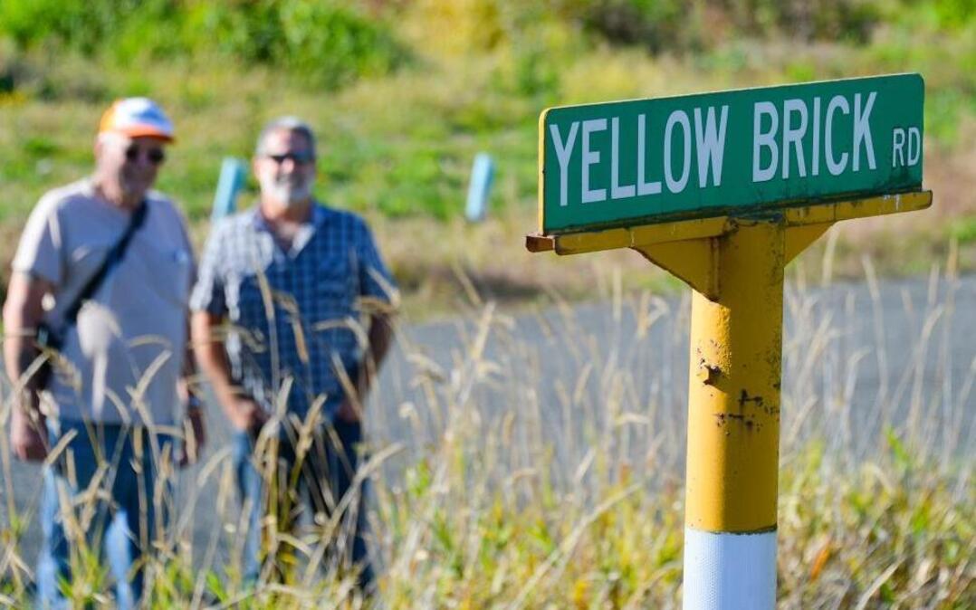 Yellow Brick Road neighbors Ray Denson, left, and Jon Rockwood stand near the intersection of Kelly and Yellow Brick roads north of Bellingham, Wednesday, Sept. 28, 2016.