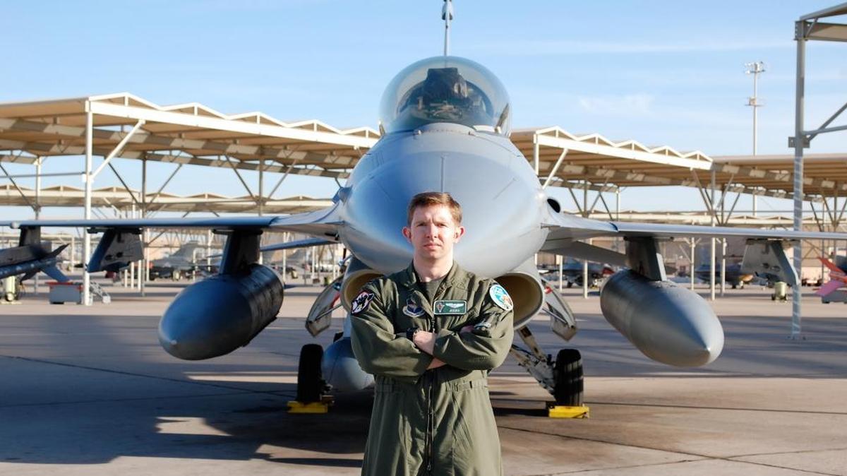 David A. Kroontje, then a first lieutenant, poses by an Air Force F-16 after he graduated from training in 2008 at Luke Air Force Base west of Phoenix, Ariz.