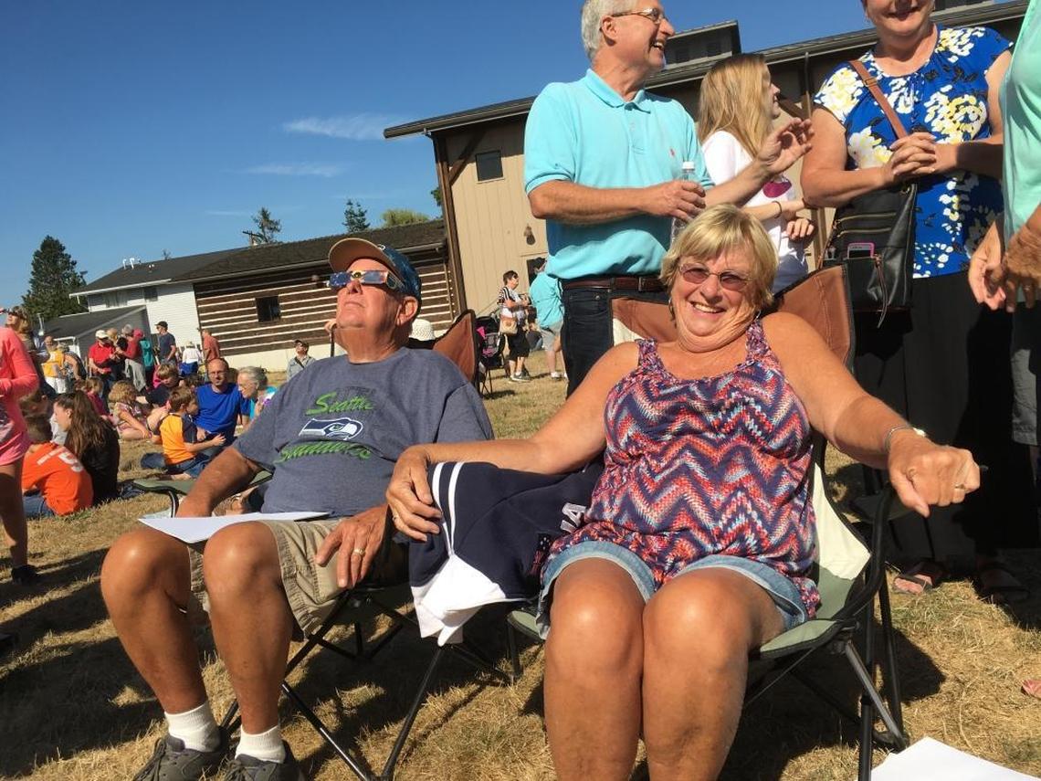 Doc and Joyce Zylstra of Lynden were among the more than 1,500 people who attended a viewing party Monday near Pioneer Park in Ferndale.
