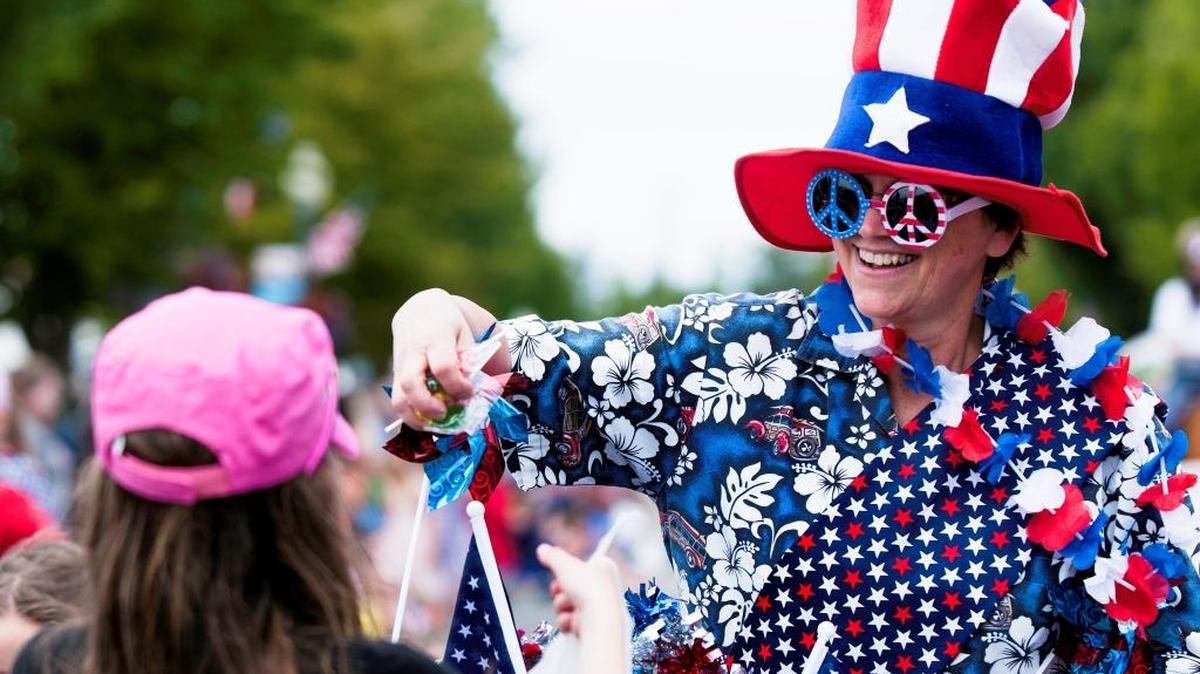 Maggie Breckenridge of Blaine hands out candy during the Old Fashioned 4th of July parade in Downtown Blaine in 2014. The high for this year’s Independence Day holiday is will be around 75 degrees.