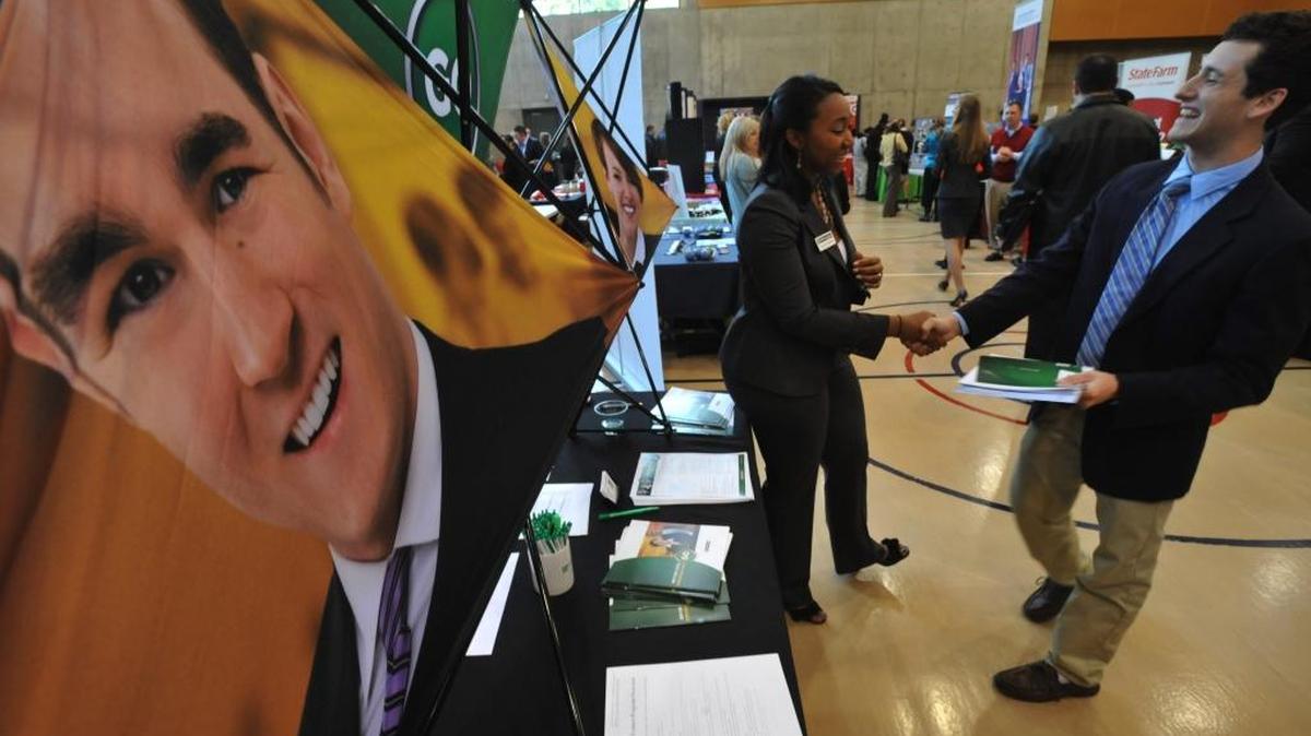 Crystal Stanfield of Enterprise Holdings talks to Western Washington University student Charlie Harbeson during the Business Career Fair in fall 2011. This year’s free event, open to the public, is 1 to 5 p.m. Thursday, Nov. 5, at the Viking Union Multipurpose Room.