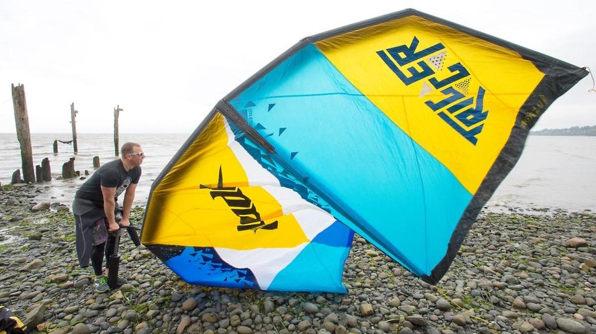 
Joel Townsan of Bellingham pumps up his kite before going kiteboarding at Locust Beach on Bellingham Bay Friday, Oct. 2, 2015. The city of Bellingham plans to build a parking lot and trailhead above the beach starting in summer 2016.
