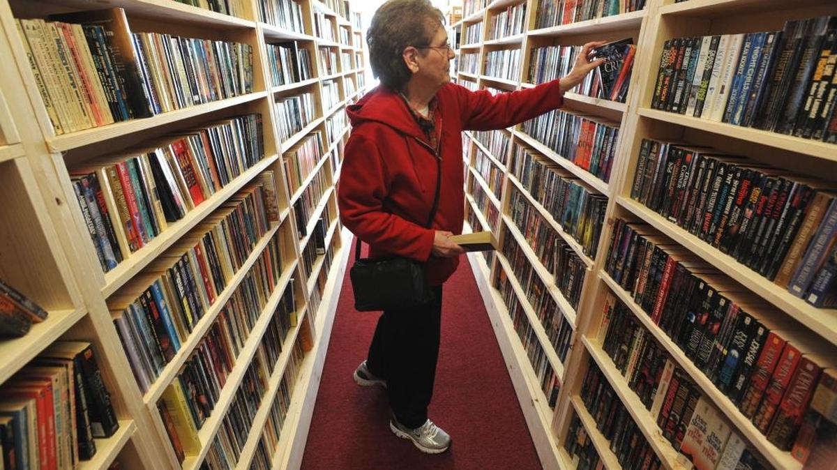 Avid reader Gay Ford searches for books at Cozy Corner Books & Coffee at 3094 Northwest Ave. in Bellingham on Jan. 19, 2011. The store is closing for good May 14, 2016, but the owners have another store in Ferndale.