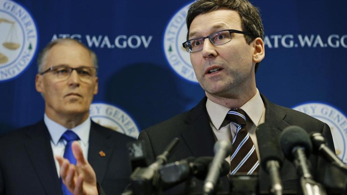 Washington Attorney General Bob Ferguson, right, and Gov. Jay Inslee speak to reporters in January about Trump’s travel ban. Both officials have said they are prepared to fight for the DACA program to continue, as it faces challenge from 10 attorneys general from conservative states.