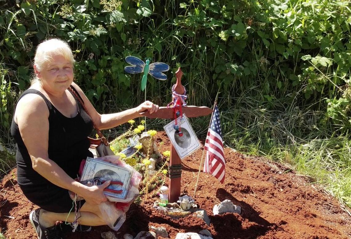 Bellingham resident Cyndi Franklin at daughter Jessica Franklin’s roadside memorial on Lincoln Street near Meador Avenue in Bellingham on July 9, 2017. The 17-year-old girl was killed and her body found there Sept. 9, 2007. Cyndi has maintained the memorial for nine years.