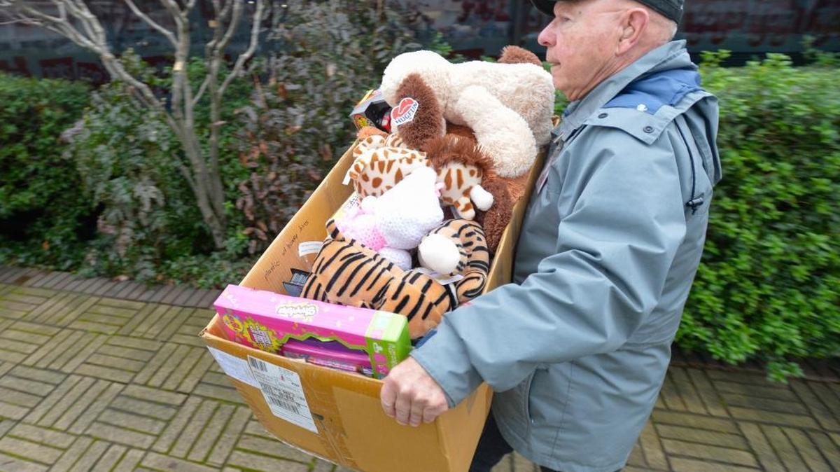 Volunteer and veteran John Forgette of Bellingham unloads toys at the Toys for Tots distribution center at 315 Lakeway Drive across from the Chevron station in Bellingham on Tuesday Dec. 8, 2015. The distribution center is open the next two Fridays and Saturdays from 9 a.m to 5 p.m.