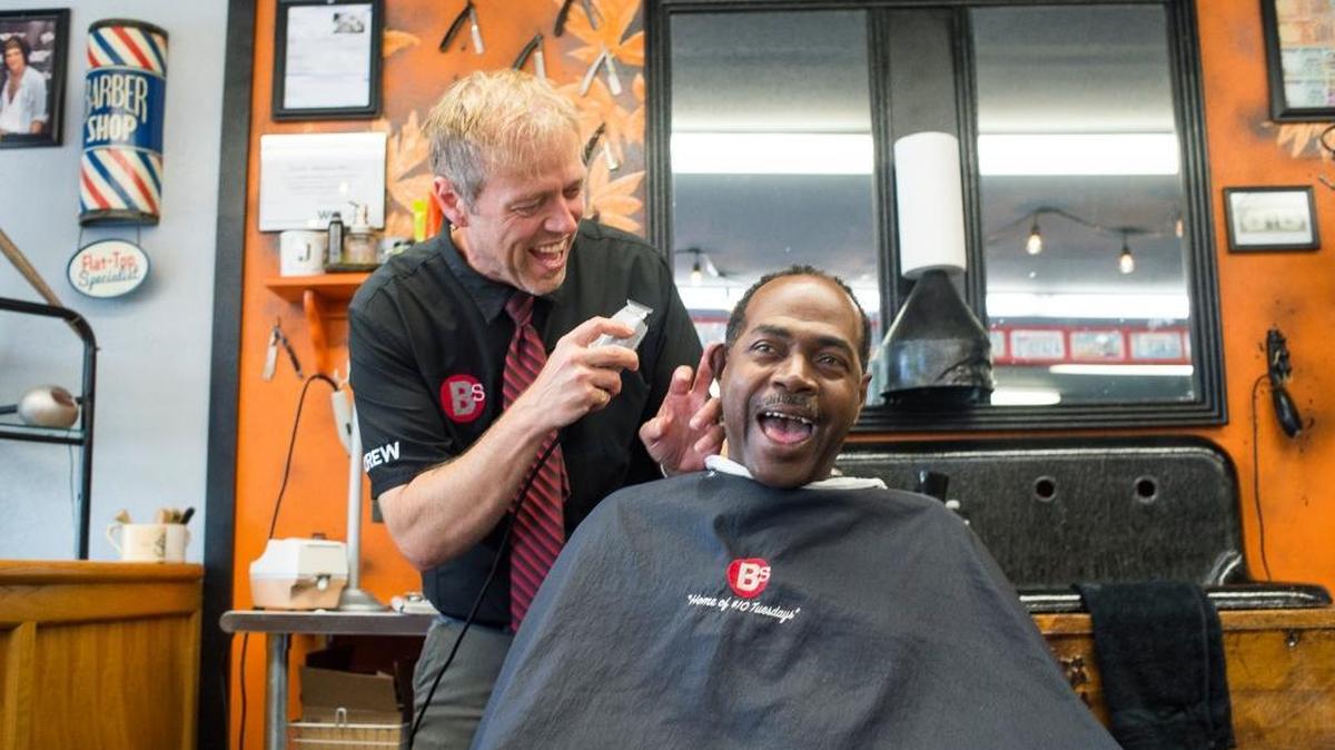 Jared Jones-Valentine, left, shares a laugh with his customer Irving Roussell during a haircut at Barber Shack on Tuesday, Aug. 8, in Bellingham. Barber Shack recently moved from its former location on Maplewood Avenue to its new location on Cedarwood Avenue.