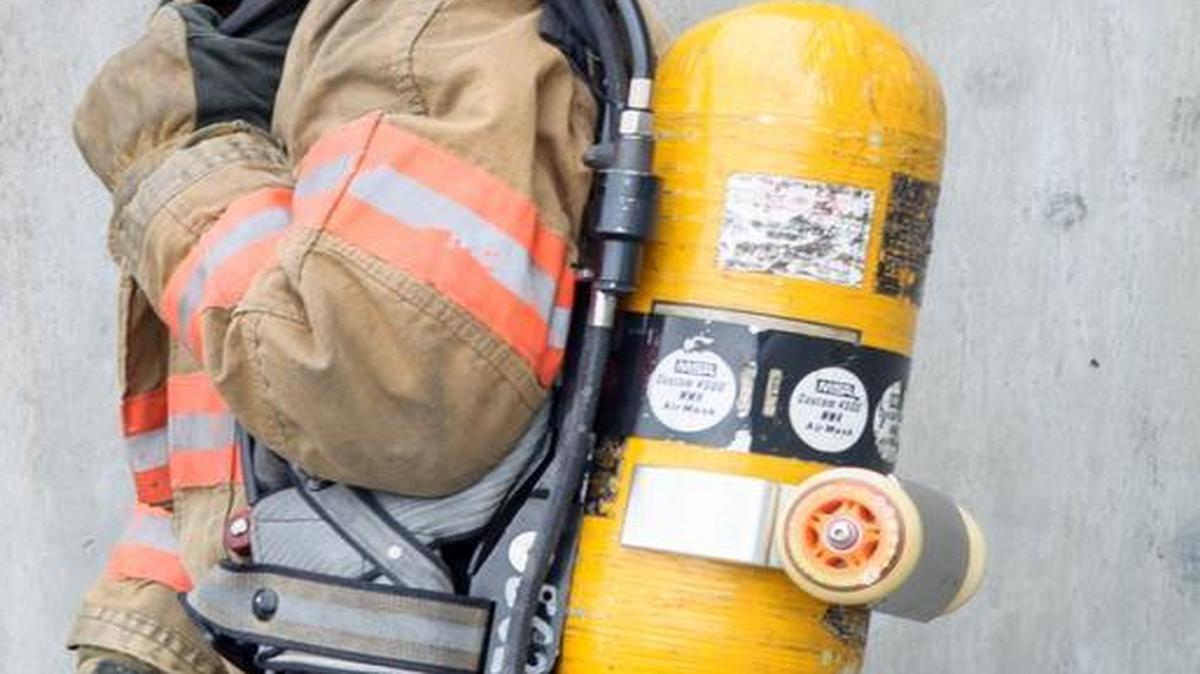 North Whatcom Fire & Rescue Capt. Joe Noonchester shows his Rescue Ride System product, which involves putting a wheel and clamp on the breathing apparatus to make it easier when rescuing people. Noonchester is one inventor who has used the NW Innovation Resource Center to launch new products.