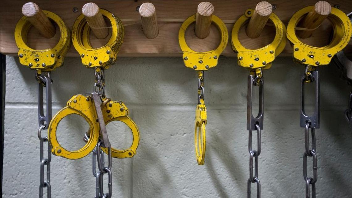 Handcuffs hang from a rack at Whatcom County Jail on Tuesday, July 21, 2015, in Bellingham. The jail measure goes before the voters Nov. 7.