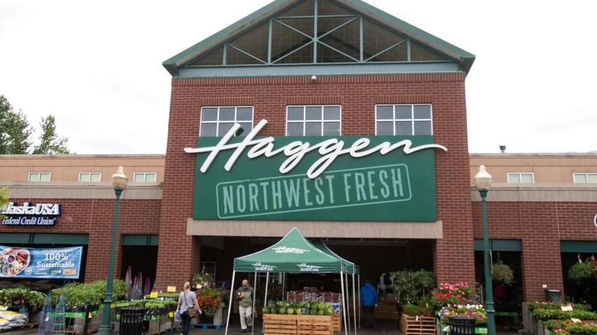 Customers come and go from the Haggen at Barkley Village on Thursday, June 2, in Bellingham. The Northwest grocer began its first full day Thursday under Albertsons ownership.