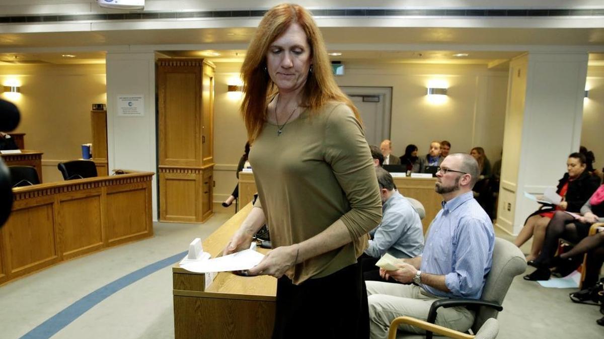Kathryn Mahan, of Puyallup, who identifies herself as a transgender woman, stands up after testifying in opposition to a bill that would eliminate Washington’s new rule allowing transgender people use gender-segregated bathrooms and locker rooms in public buildings consistent with their gender identity, Wednesday, Jan. 27, 2016, at the Capitol in Olympia, Wash.