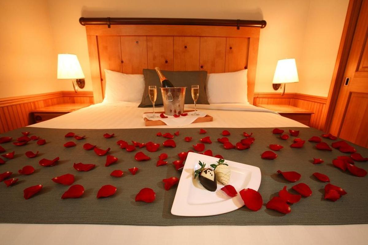 Decorated strawberries, keepsake champagne flutes, champagne and rose petals await a bride and groom in their suite at Semiahmoo Resort in Blaine.