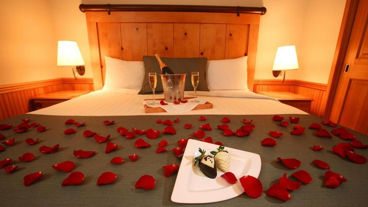 Decorated strawberries, keepsake champagne flutes, champagne and rose petals await a bride and groom in their suite at Semiahmoo Resort in Blaine.