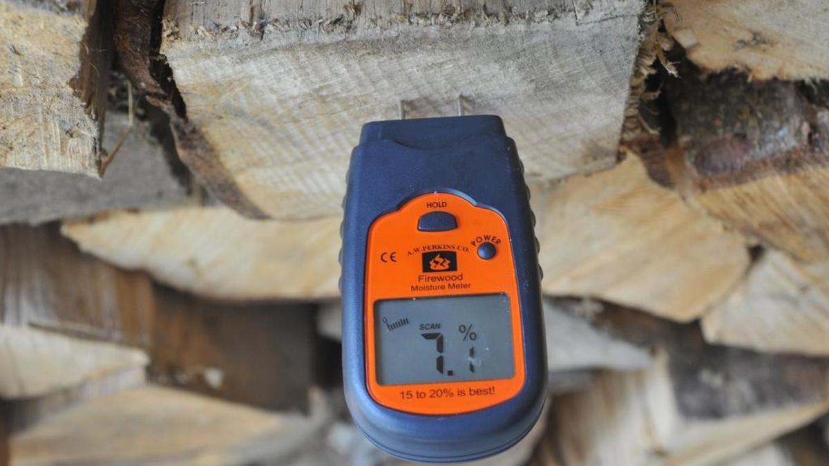 A meter measures the amount of moisture in a log Sept. 14, 2012, in Sudden Valley. The Northwest Clean Air Agency is asking people to refrain from burning wood while an air stagnation advisory is in effect, but if you need it for heat make sure your firewood is dry.