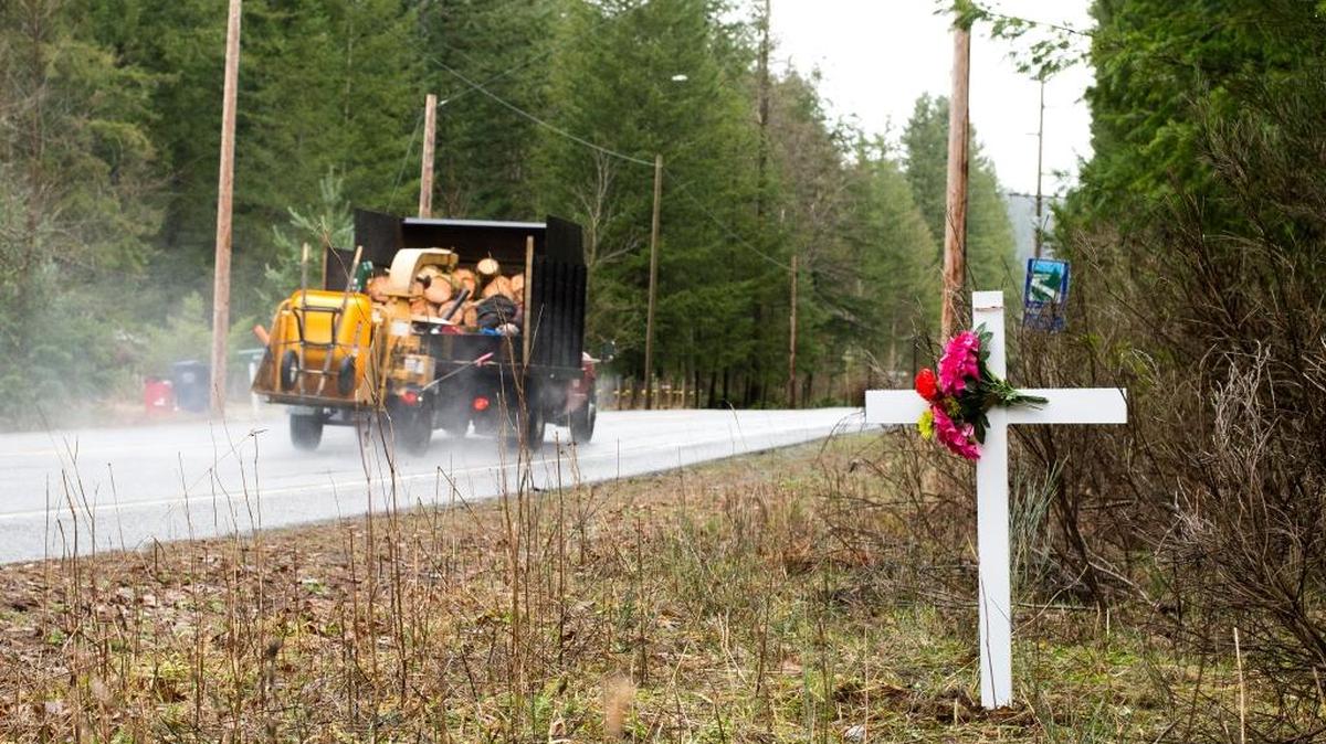 A cross marks a spot near the intersection of Kendall Road and Limestone Road where Jordan D. Sant, 14, was killed when he was hit by a truck while riding his bicycle Wednesday night, Jan. 27, near Kendall, Wash.