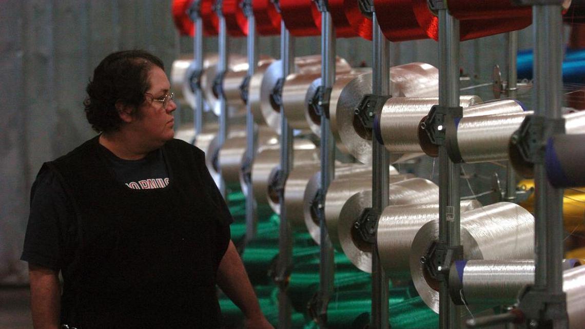 A worker checks spools of fiber being made into strands of rope at the Samson Rope Technologies, Inc. plant in Ferndale in 2008. The company sells rope to customers all over the world and has acquired a Spanish manufacturing company.