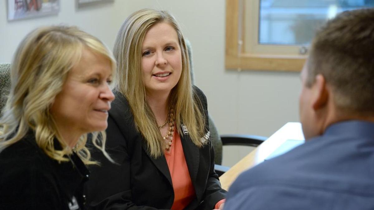 Whatcom Educational Credit Union's Chief Human Resources Officer Cindy Klein, left, President /CEO Jennifer Kutcher and Executive Vice President Jeff Dykstra meet Friday at the WECU main branch in Bellingham.