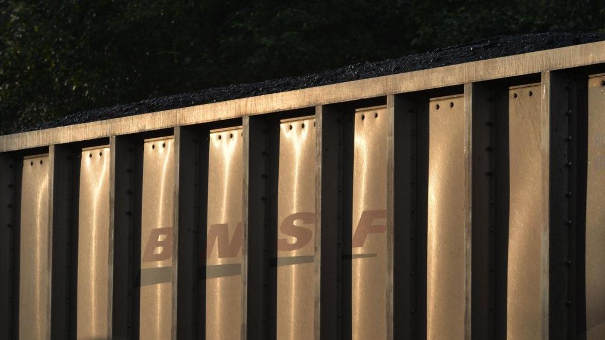 A BNSF train carrying coal in uncovered cars waits south of Blaine on Oct. 11, 2013, to cross the border and unload in Canada.