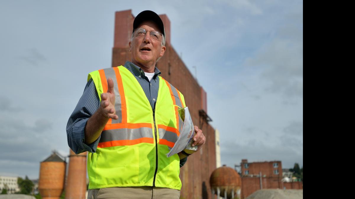 
Mike Stoner, Port of Bellingham environmental director, answers questions during a Waterfront Twilight Walking Tour on the Georgia-Pacific site on Aug. 1, 2013. Stoner is retiring after more than 20 years working for the port on waterfront cleanup. 
