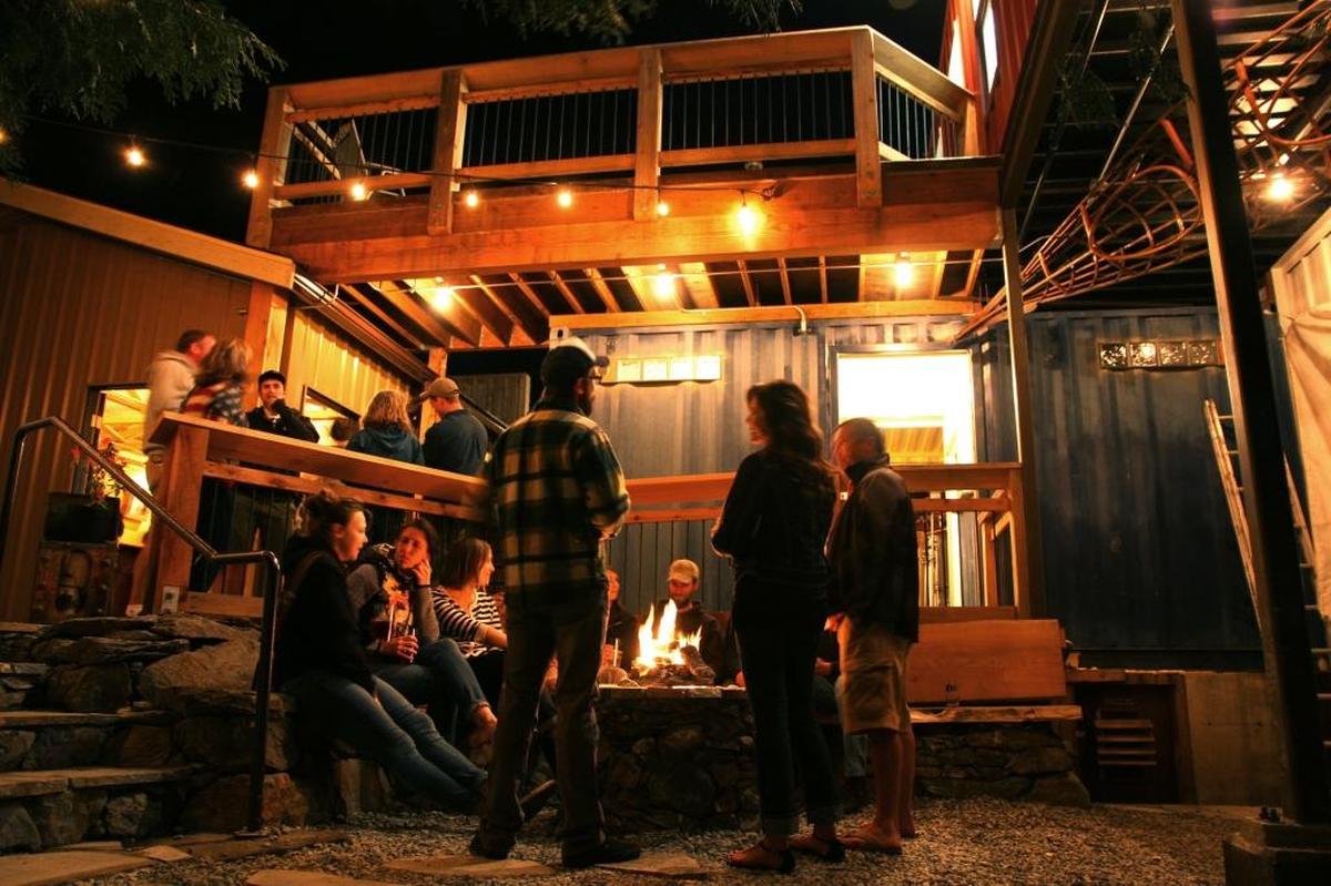 Guests hang out around the fire pit at 1009 Larrabee Ave. in Bellingham. 