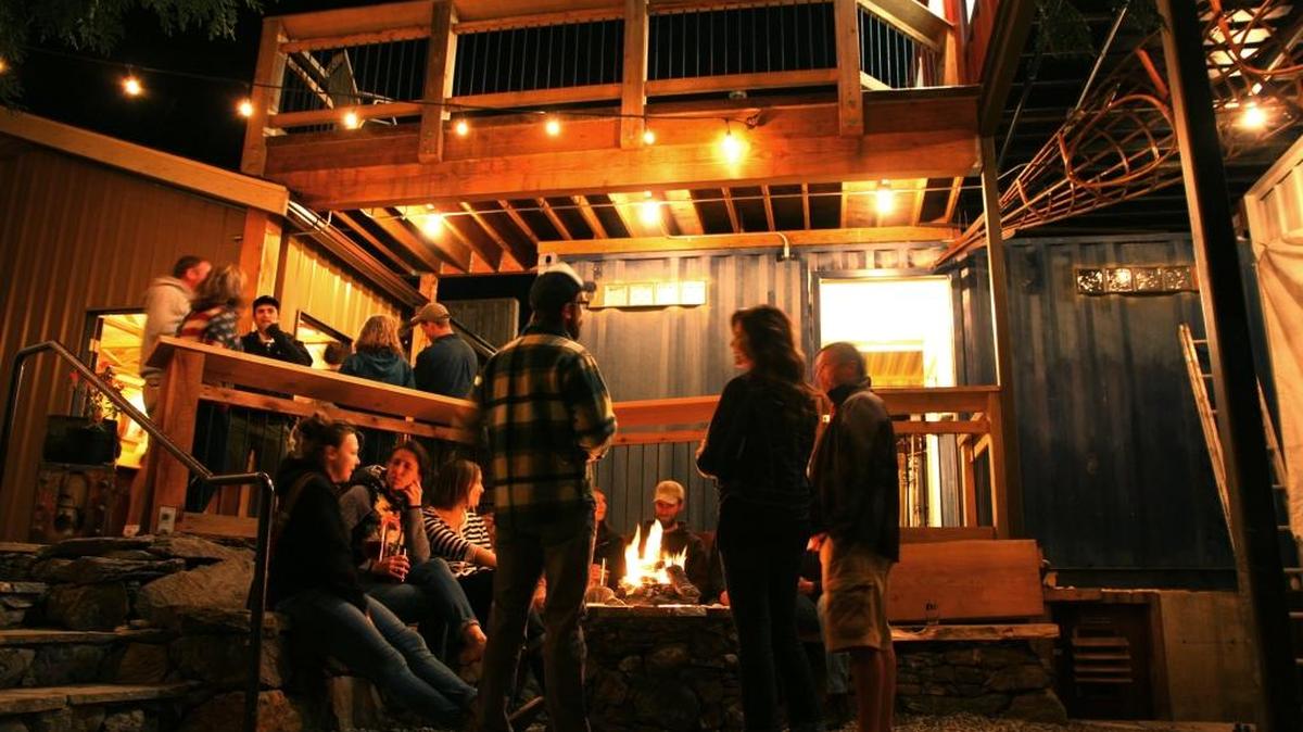 Guests hang out around the fire pit at the Fairhaven Stones Throw Brewery at 1009 Larrabee Ave. The brewery is planning to have its official opening Wednesday, April 13. Once open, hours will be 11 a.m. to 9 p.m. Wednesday through Sunday.