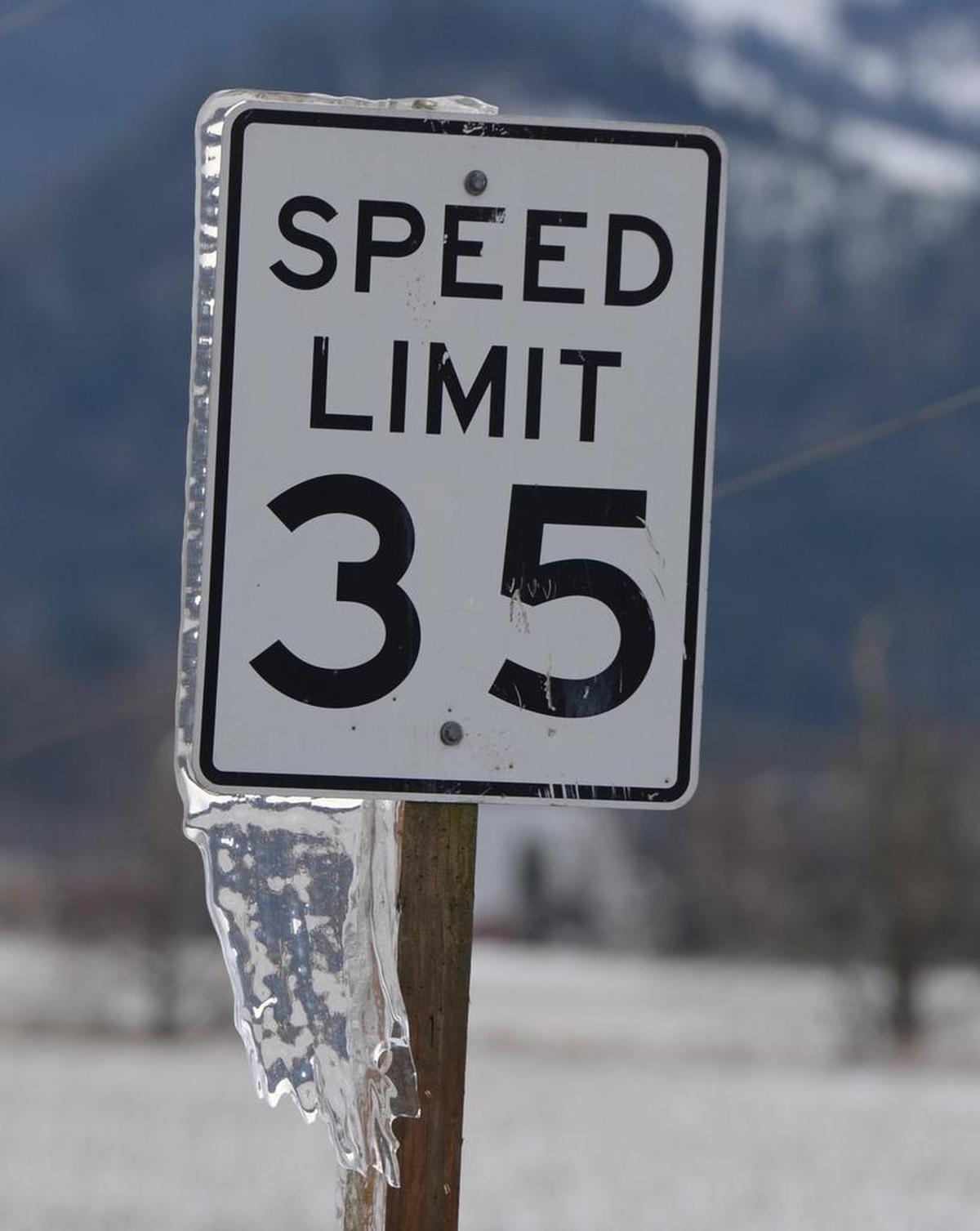 A speed limit sign is covered in ice along Garrison Road near Sumas, Tuesday, Jan. 2, 2018.