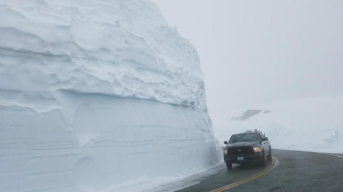 Snow is still piled high along Mount Baker Highway near where crews are clearing the last few miles to Artist Point. The final stretch of SR542 is expected to open June 29.