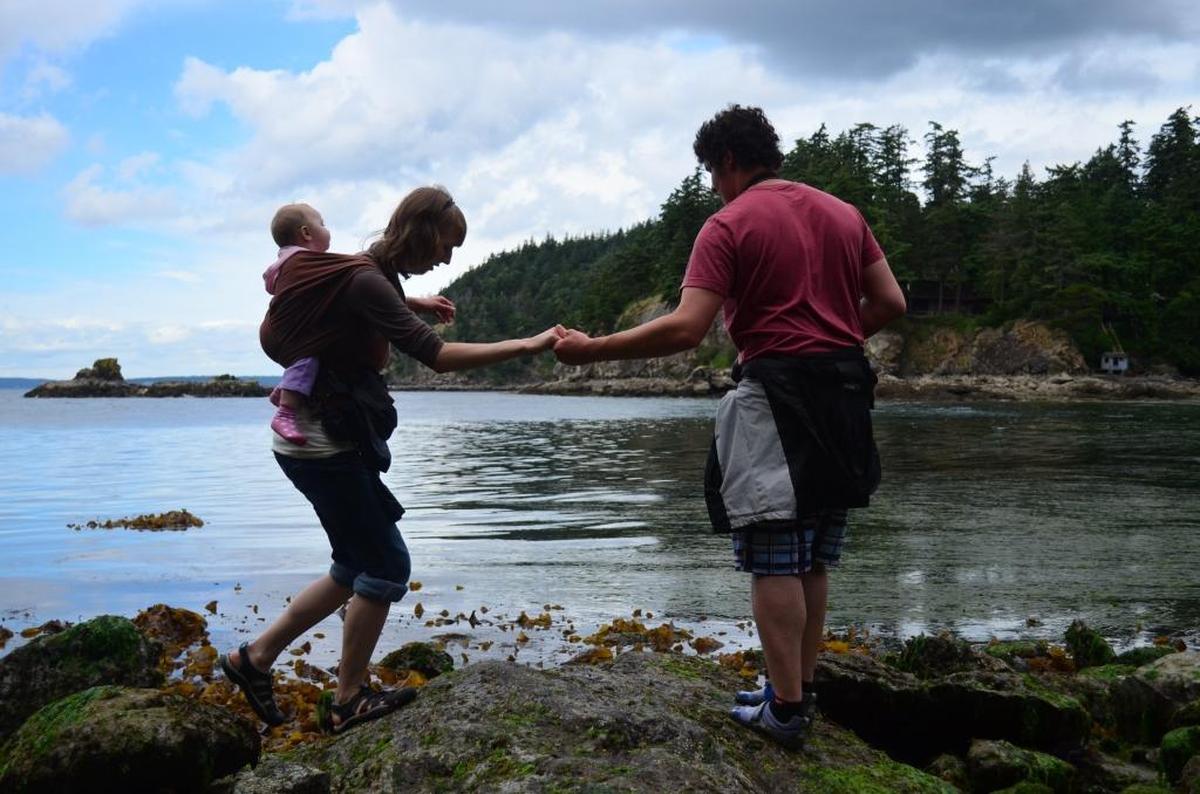 Anna and Matt van Voorst investigate tidepools with daughter Heidi June 25, 2013, at Larrabee State Park. The park turns 100 on Friday, OCt. 23.