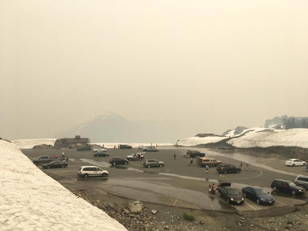 Smoke from wildfires in British Columbia on Friday afternoon obscures what’s normally a sweeping vista of Mount Shuksan and the North Cascades high peaks from Artist Point at the east end of the Mount Baker Highway.
