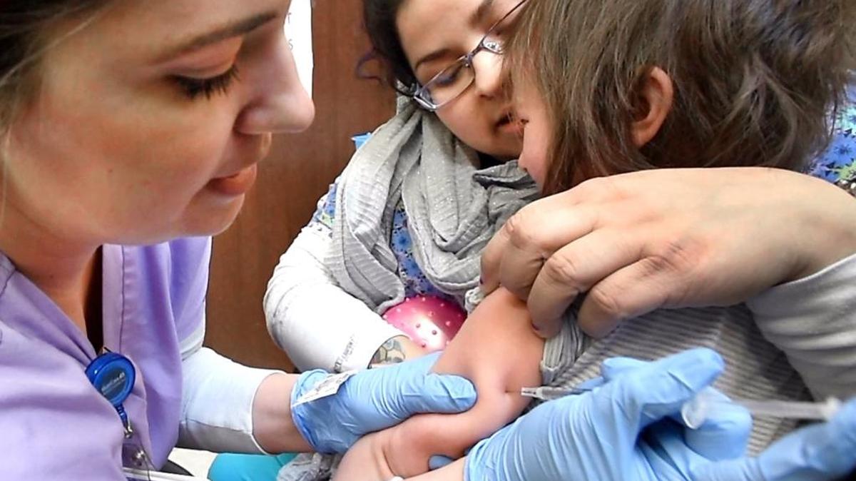 Cara Russell comforts her tearful daughter as she receives a free vaccination update for measles, mumps and rubella (MMR) from LPN Christine Russell at the Mary Bridge Children’s immunization clinic at the South Hill Mall in Puyallup on Jan. 12, 2017. The clinic has seen an increase in patients due to Washington’s largest mumps outbreak in years.